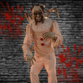 Evil clown animatronic holding doll with violent motion in haunted carnival scene