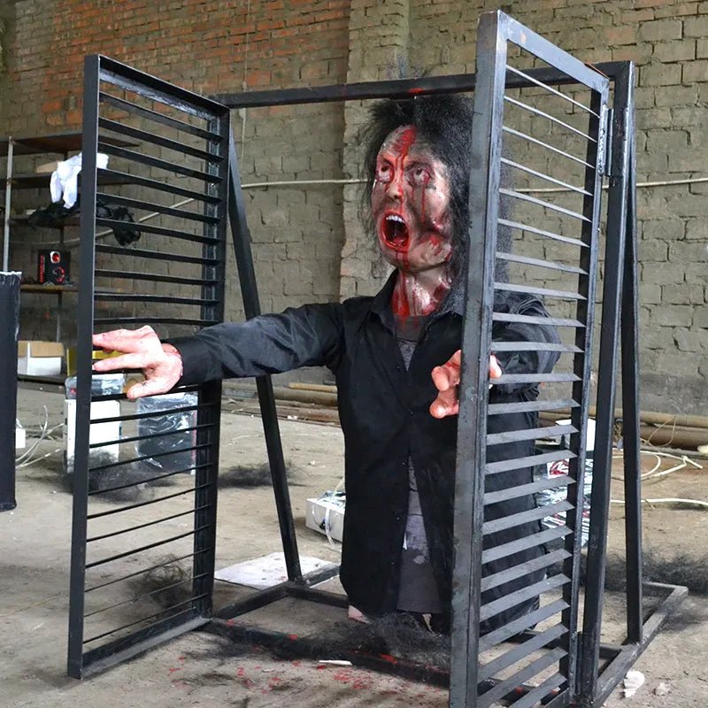 animatronic zombie jumping out of window with smoke effect for haunted attraction
