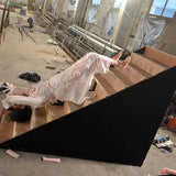 female ghost animatronic crawling down staircase with blood-stained face