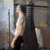 electric shock zombie animatronic strapped to panel with exposed chest