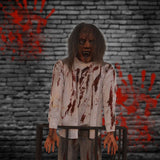 standing bloody zombie animatronic with long hair and screaming expression
