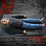 female corpse animatronic lying on platform in haunted morgue setting
