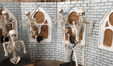 dancing skeleton animatronics in haunted chapel setup
