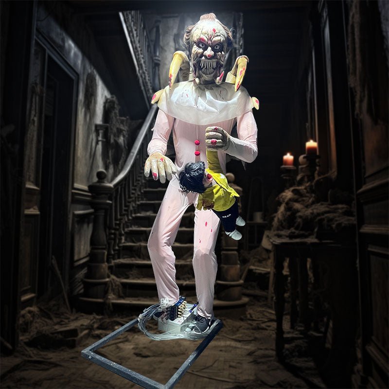 Evil clown animatronic holding doll with violent motion in haunted carnival scene
