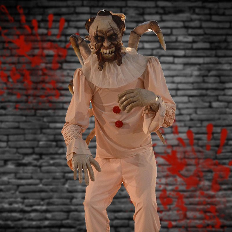 Evil clown animatronic holding doll with violent motion in haunted carnival scene