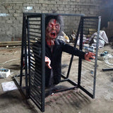 animatronic zombie jumping out of window with smoke effect for haunted attraction