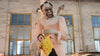 Evil clown animatronic holding doll with violent motion in haunted carnival scene